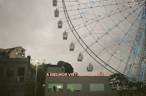 Cityscape with Ferris wheel near modern buildings