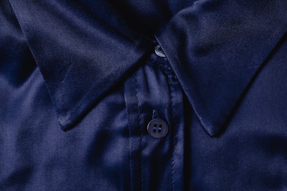 Close-up of a bartender's uniform fabric, showcasing a custom fit and subtle, attractive detailing like a unique button or texture - sexy bartender uniforms Close-up of a bartender's uniform fabric, showcasing a custom fit and subtle, attractive detailing like a unique button or texture - sexy bartender uniforms