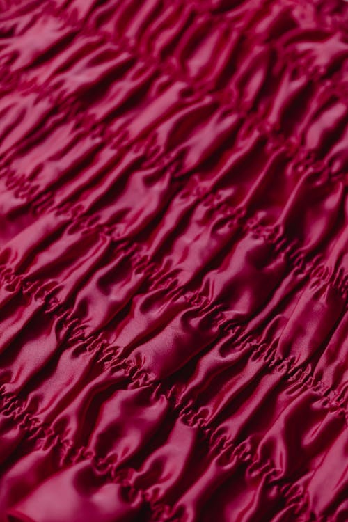 Close-Up Shot of a Magenta Fabric