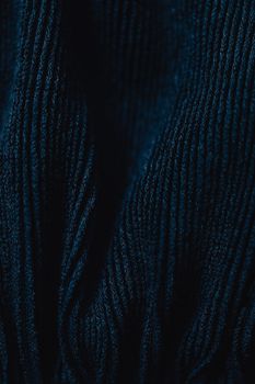 Close-up view of navy corduroy fabric highlighting its texture and pattern.