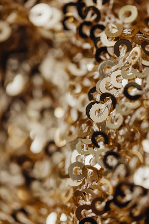 Close-Up Photograph of Gold Sequins