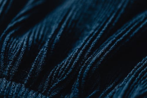 Close-Up Shot of Dark Blue Knit Textile