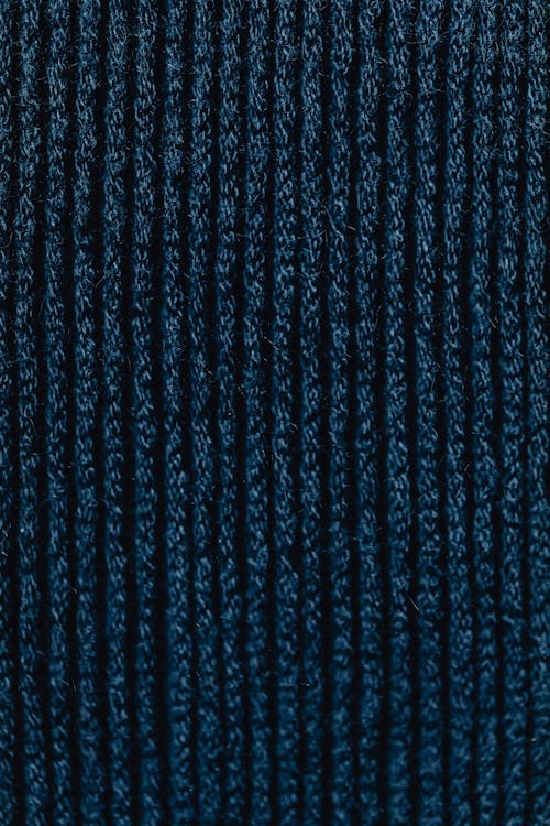 Close-Up Shot of Dark Blue Knit Textile
