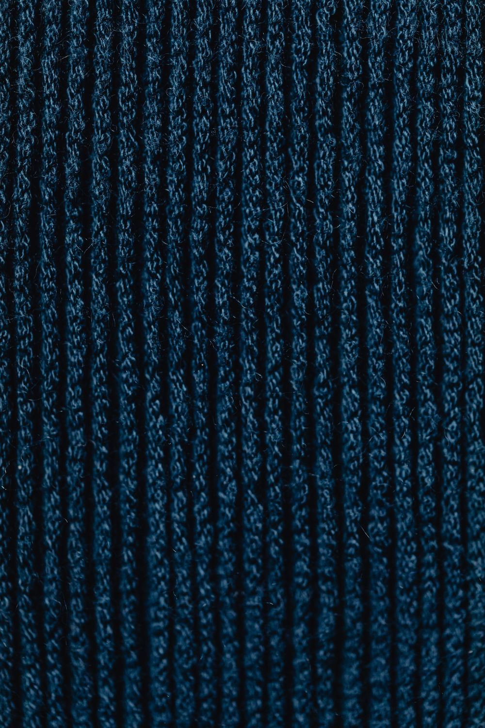 Close-Up Shot of Dark Blue Knit Textile ยท Free Stock Photo