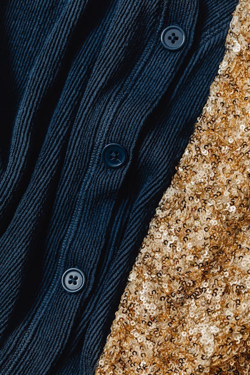 Close-Up Shot of a Dark Blue Knitwear and Gold Sequins