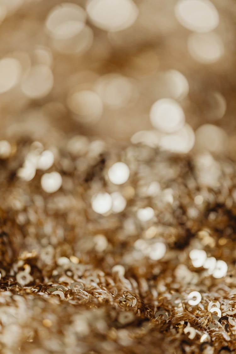 Gold Sequins On A Fabric 