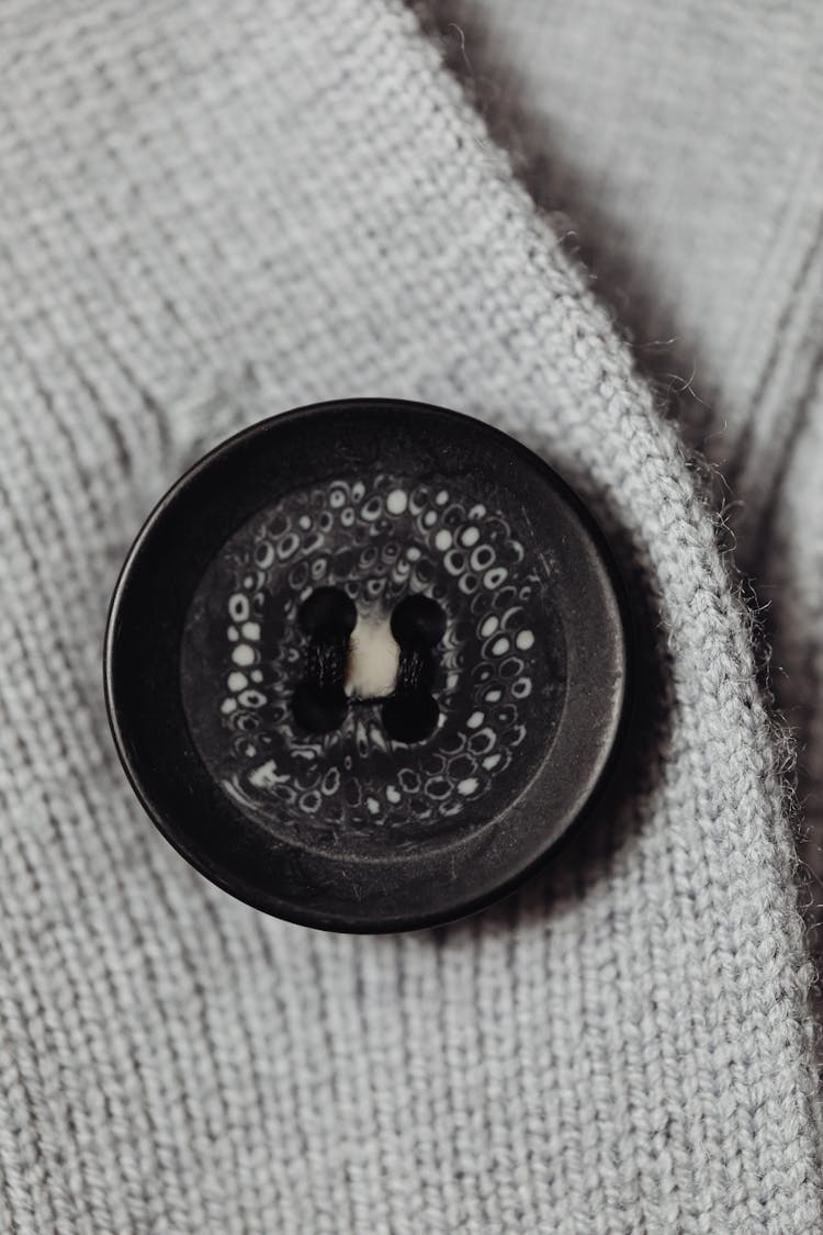 Close-Up Shot Of A Black Button 