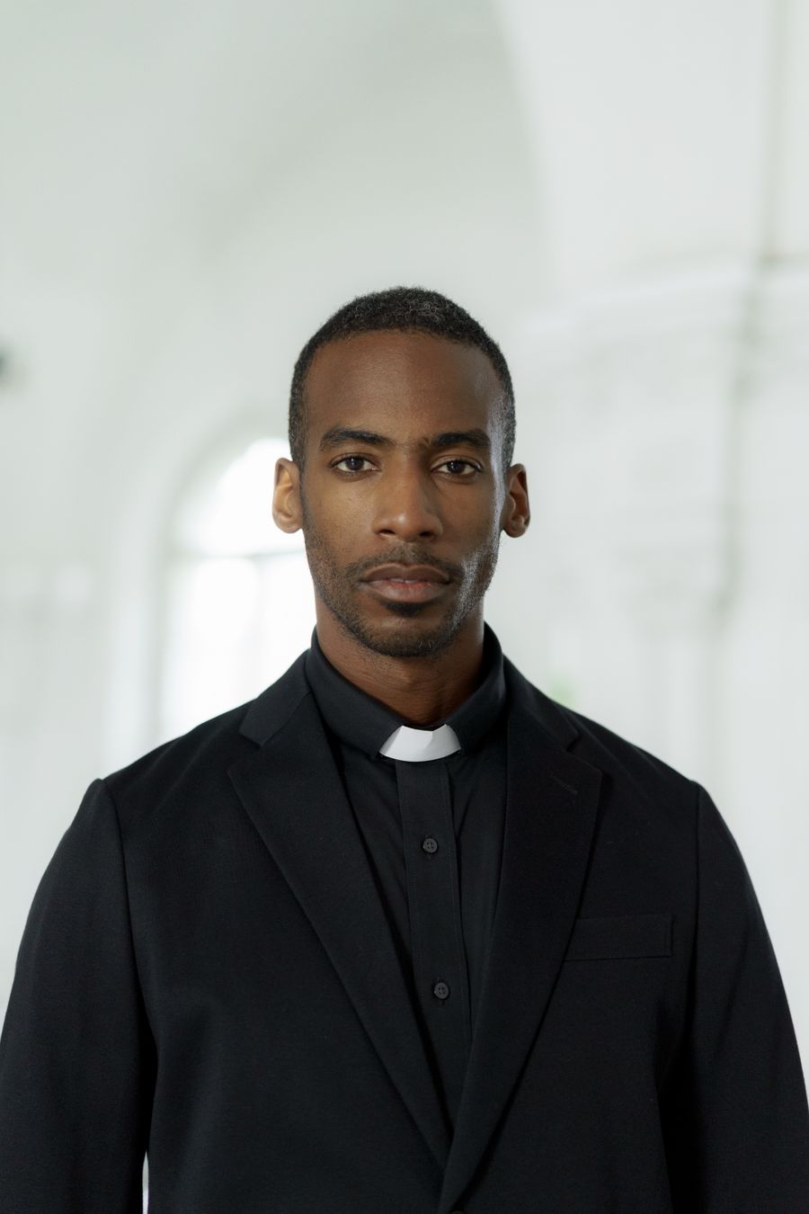 Portrait of Pastor Samuel Okafor in a clerical collar