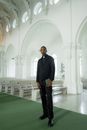 Photograph of a Pastor Standing Inside a Church