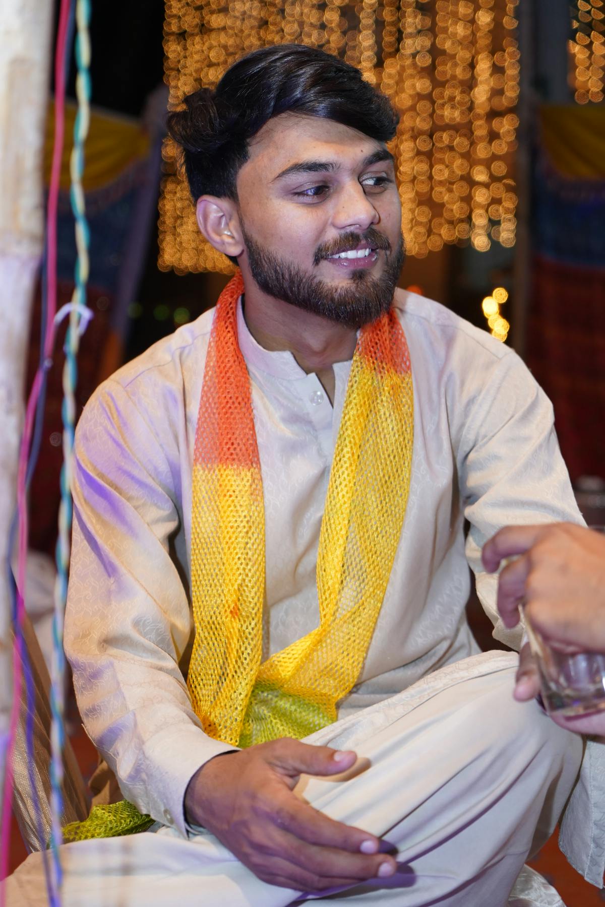 Person checking horoscope on a smartphone while drinking coffee