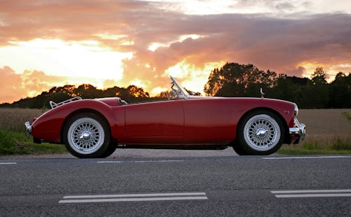 Free Red Coupe Soft-top on Road Stock Photo