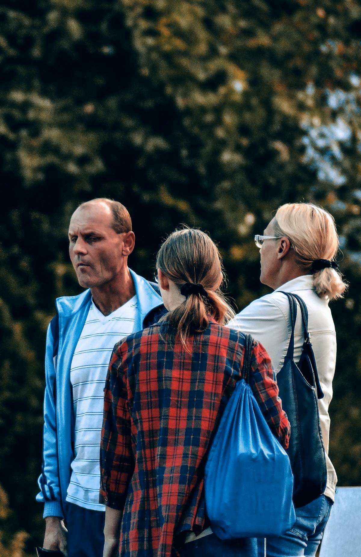 Person reading celebrity gossip on a laptop while holding a coffee mug