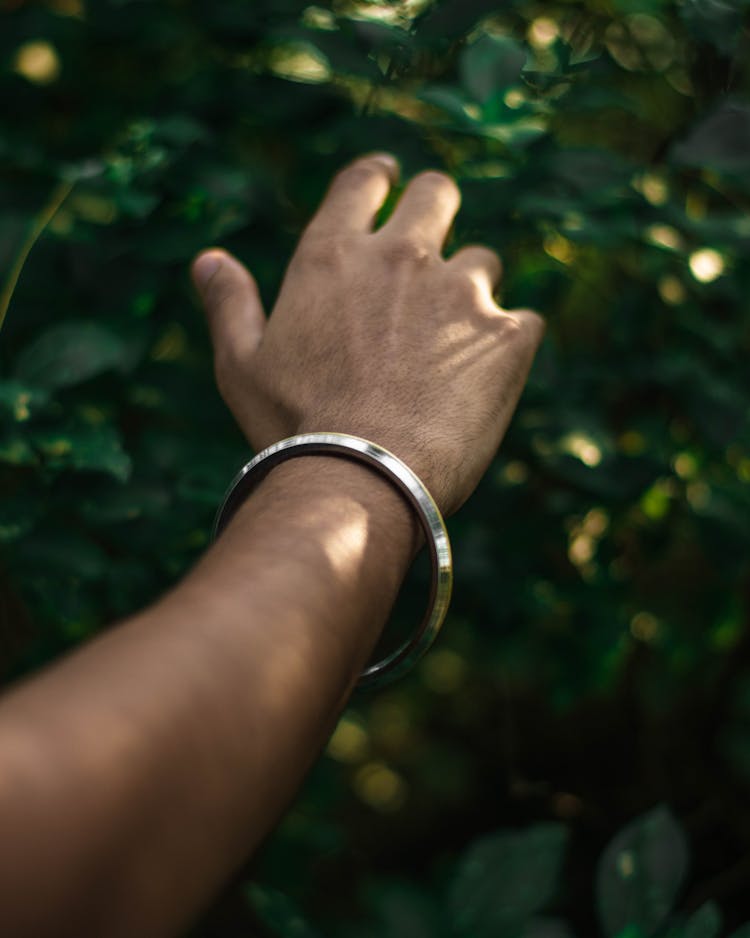 Person Wearing Silver Bangle