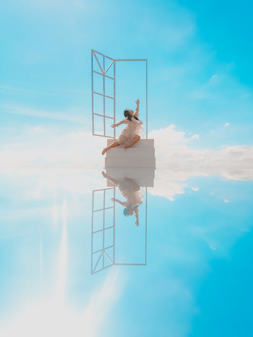 Free A Woman Dancing Under the Clear Blue Sky Stock Photo
