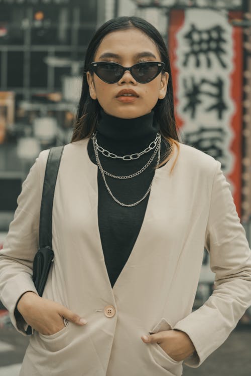 Portrait of a Fashionable Young Woman Wearing Sunglasses 