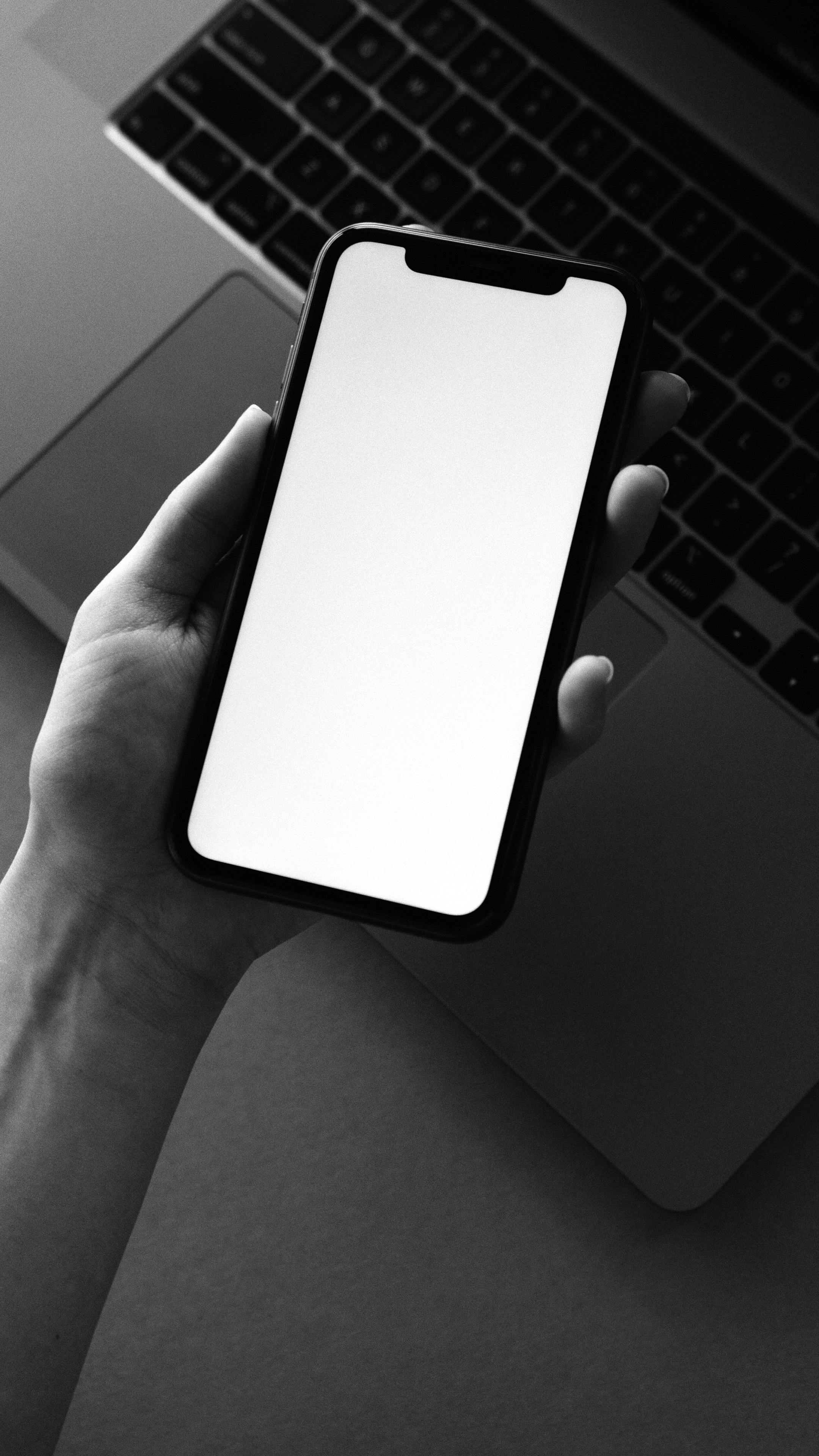 person holding black iphone