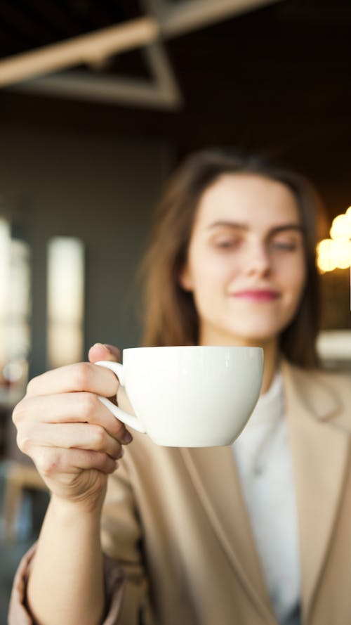 Woman Holding A Coffee Cup