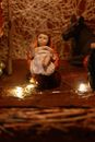 Close Up Photo of a Figurine of Baby Jesus in a Manger