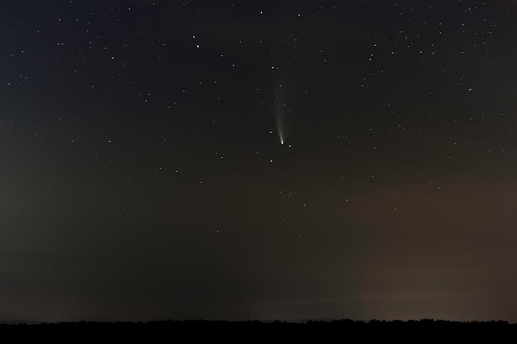 Shooting Star On Night Sky