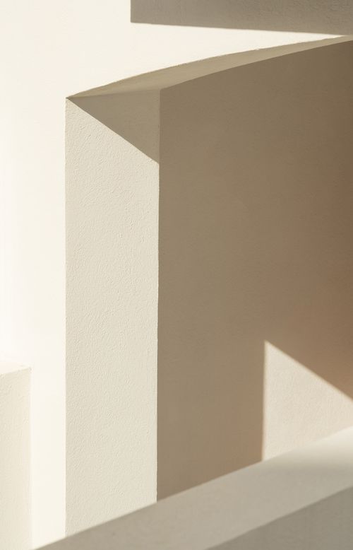 Free A minimalist image showcasing light and shadow on architectural forms. Stock Photo