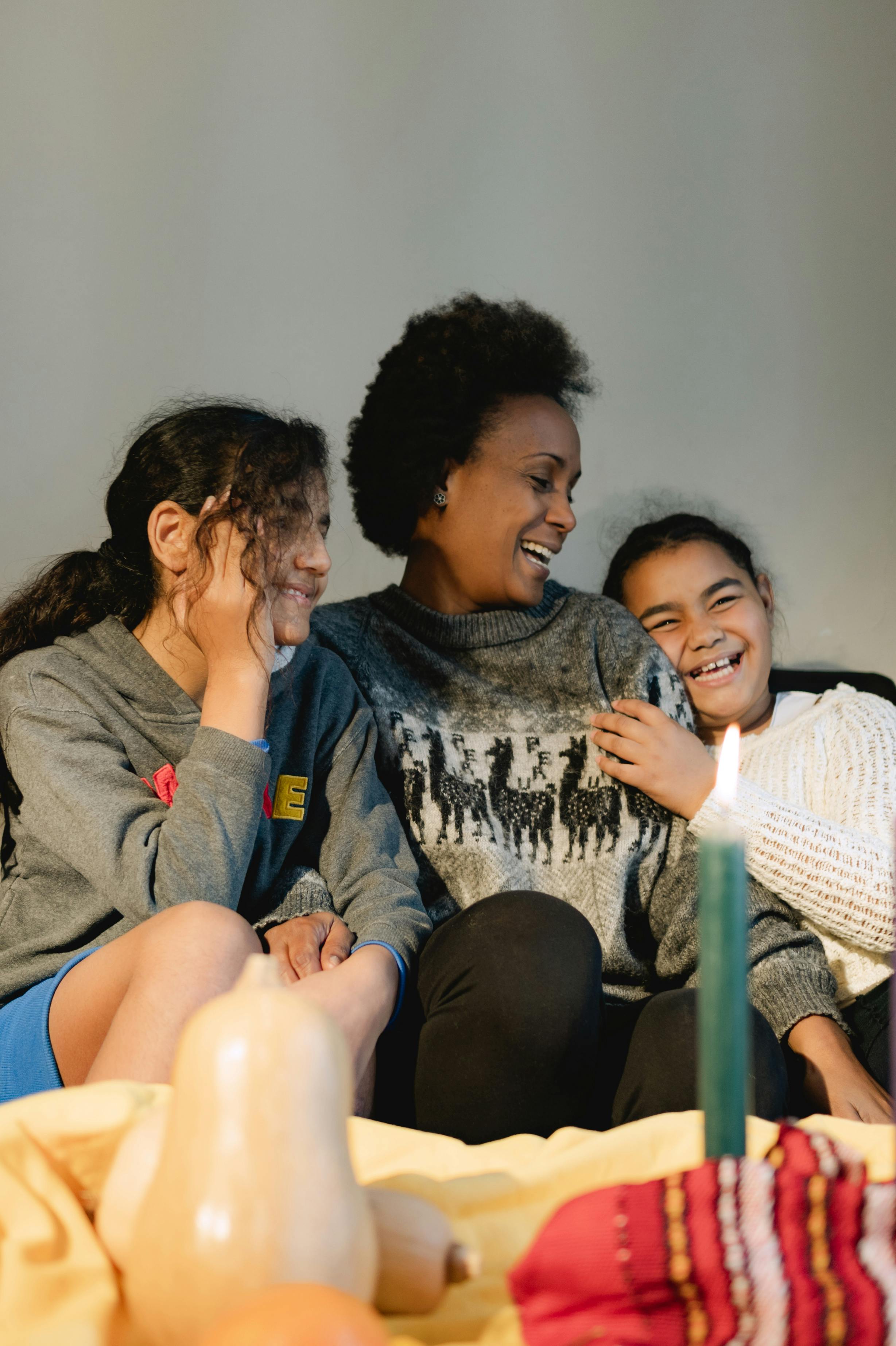 A Family Sitting On The Couch Free Stock Photo   Pexels Photo 6280120 