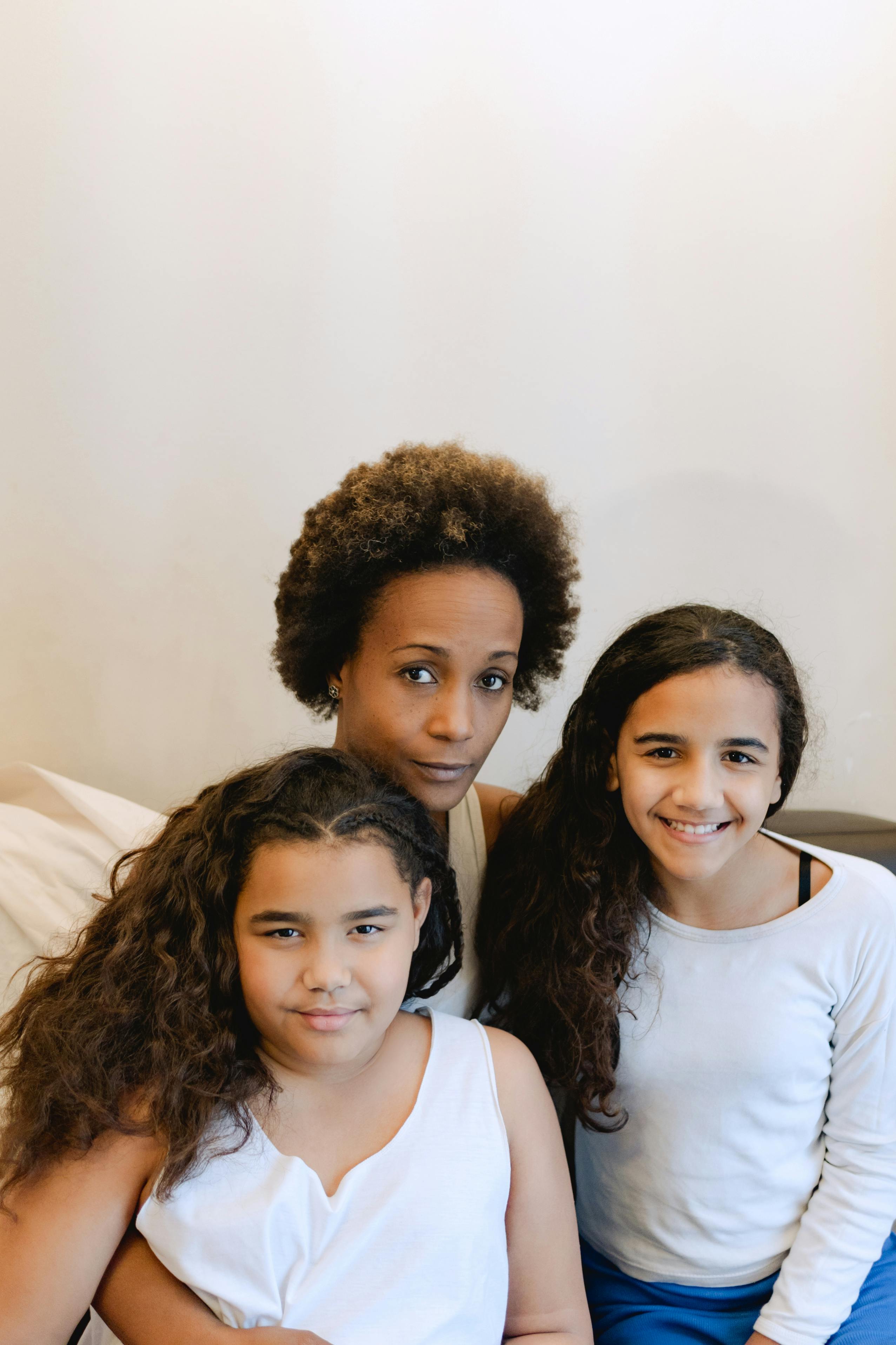 mother sitting with her beautiful daughters