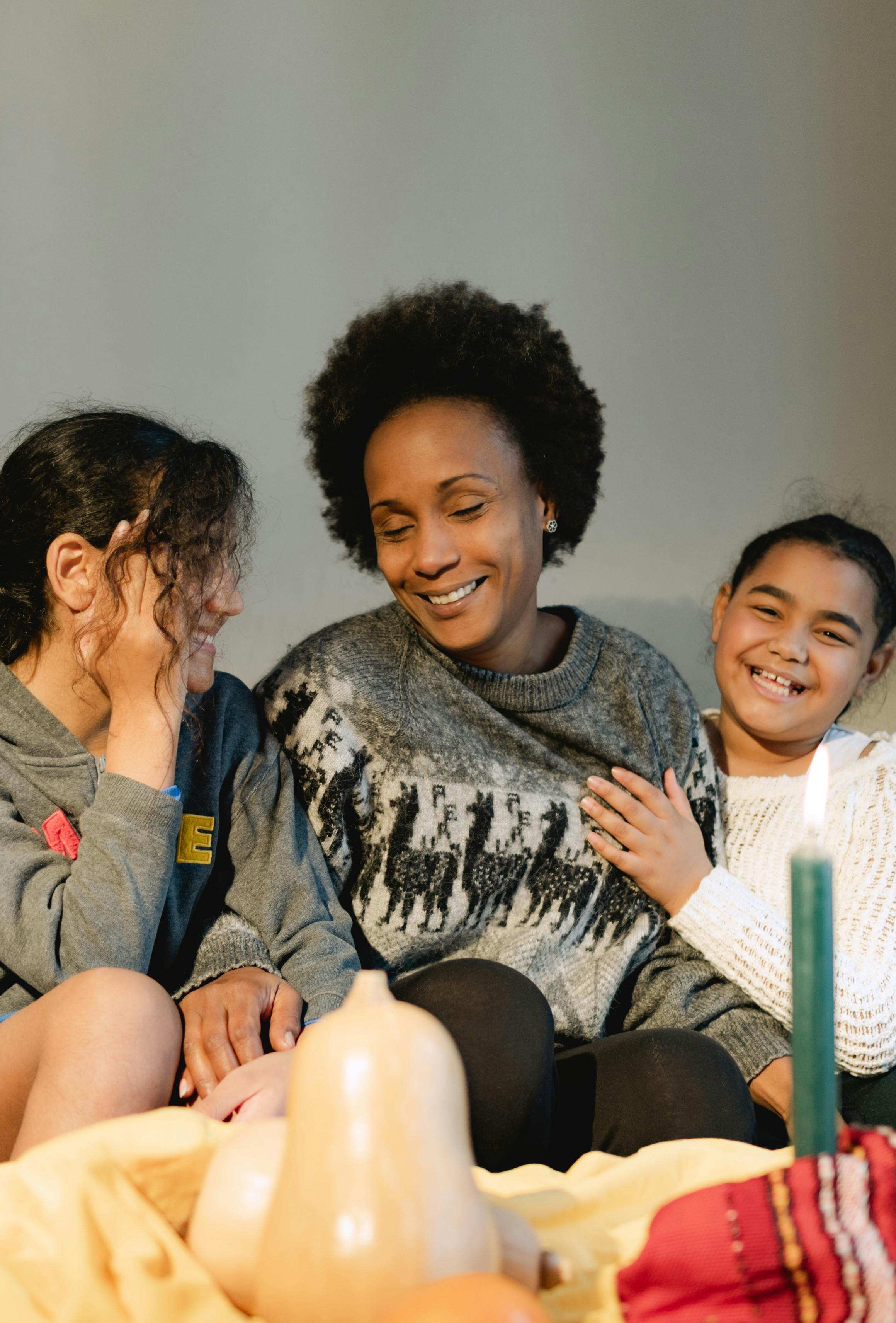 a family sitting on the couch