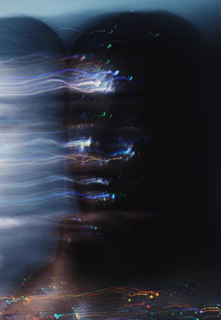 An abstract portrait created using long exposure and light painting techniques.