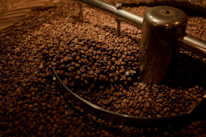 Fresh coffee beans being roasted in small batches at Grounded