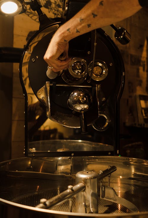 A Person Operating a Coffee Roaster