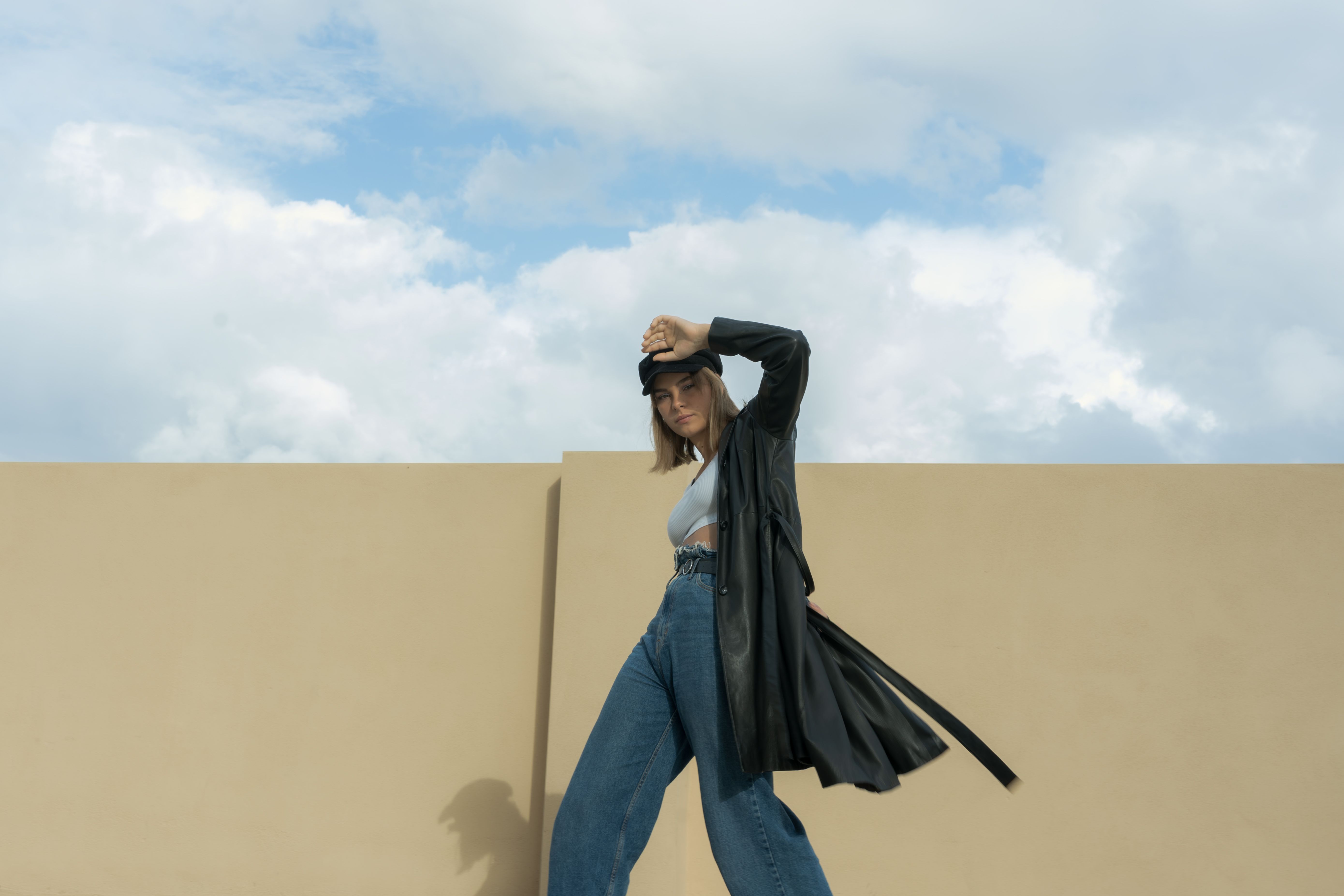 a woman wearing a classic trench coat outfit - autumn outfits for ladies
