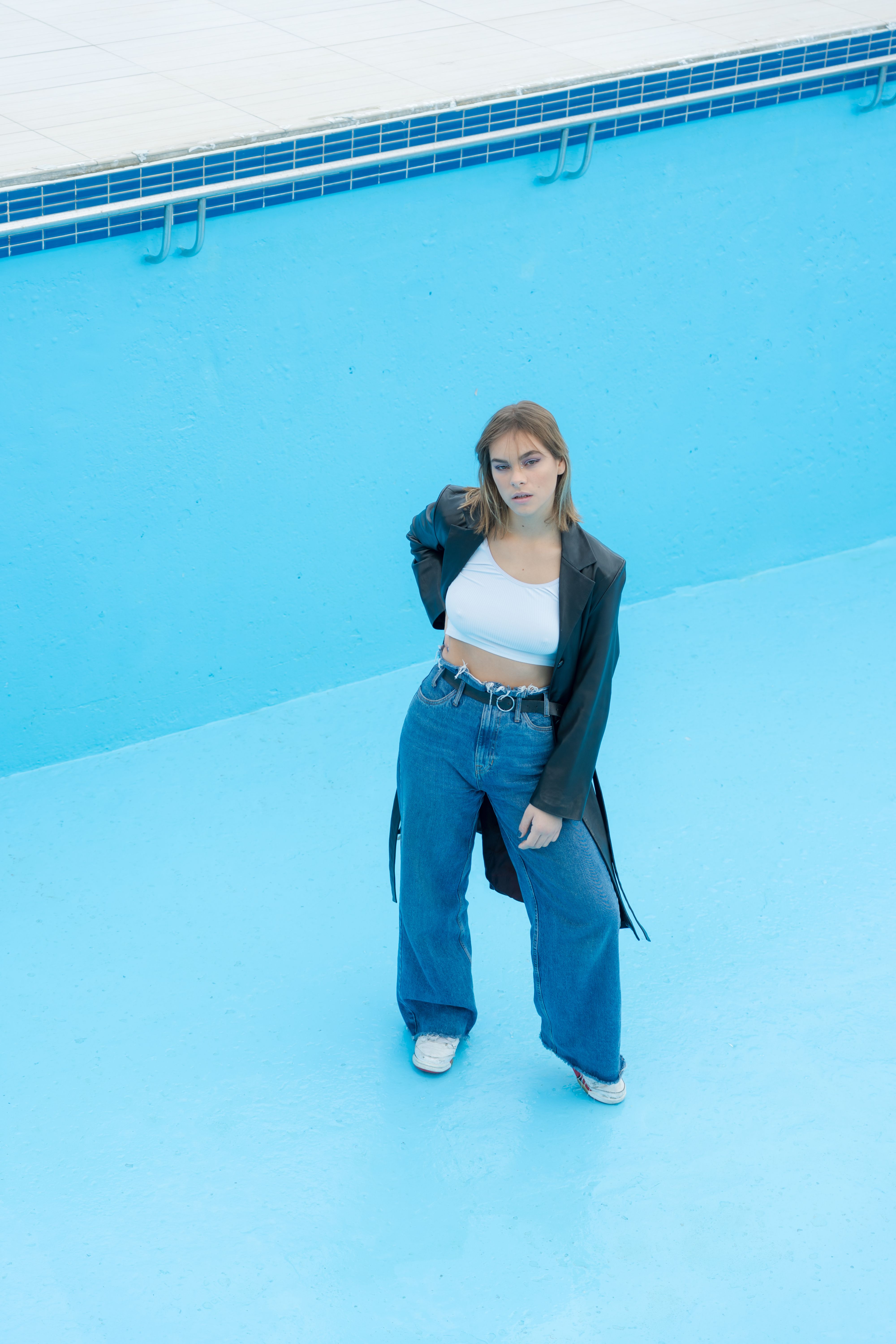 A Woman in Black Jacket and Blue Denim Jeans · Free Stock Photo