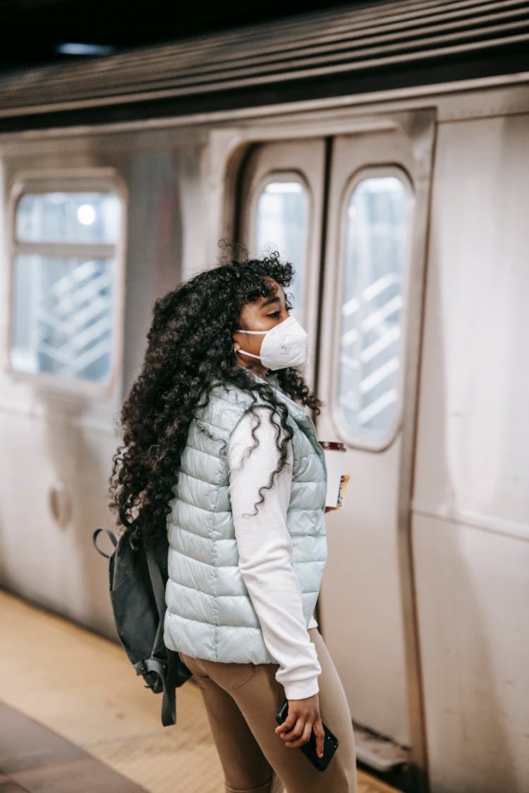 Black Woman Waiting For Entering Underground Train