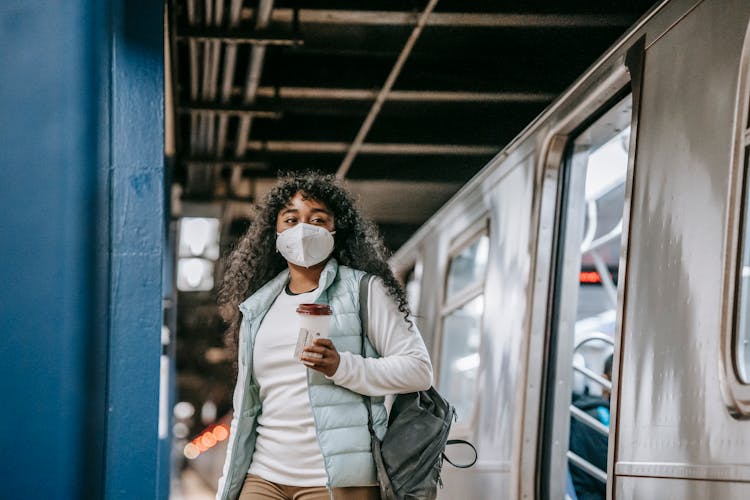 Black Woman In Mask Leaving Metro Train