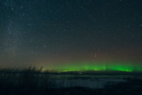 Free Capture of the breathtaking aurora borealis and starry night sky in Russia, showcasing nature's beauty. Stock Photo