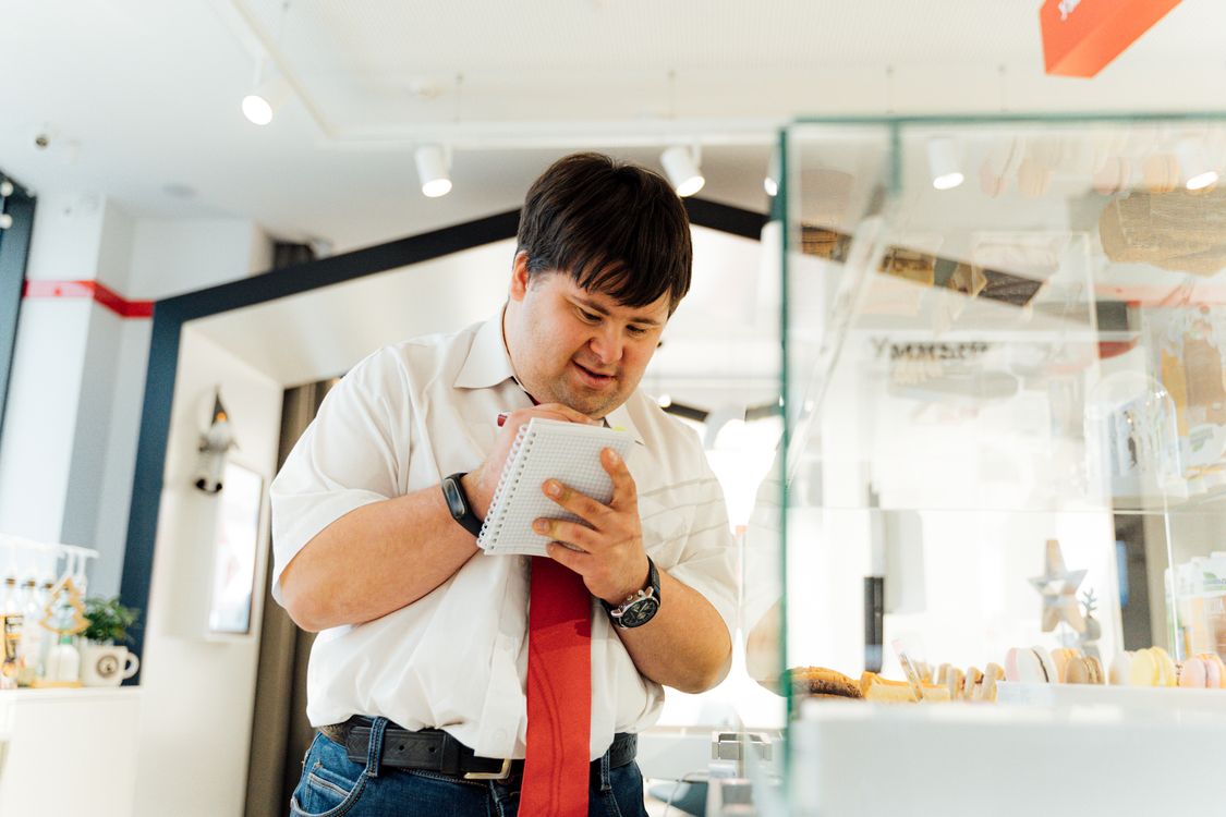 A Man Holding a Notebook · Free Stock Photo