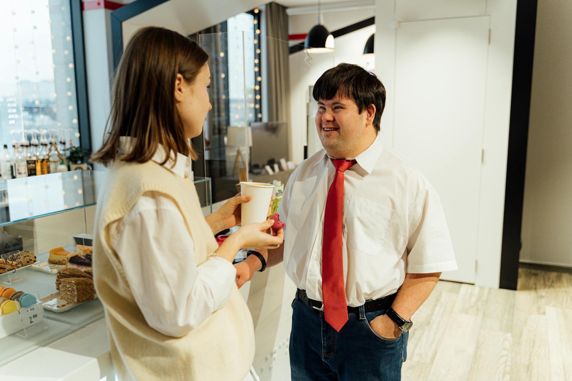 A Manager Talking to a Customer at the Café