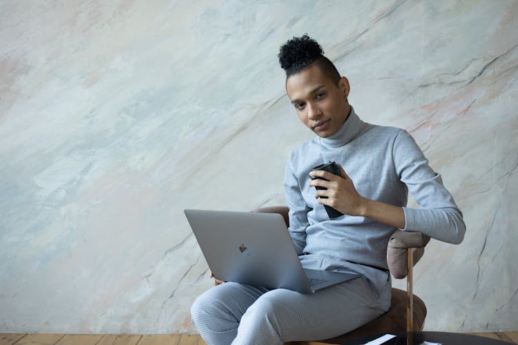 Serious Black Student Using Laptop For Studies