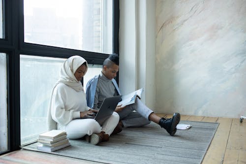 Free Serious black students doing assignment together Stock Photo