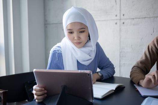 woman taking online quiz on tablet