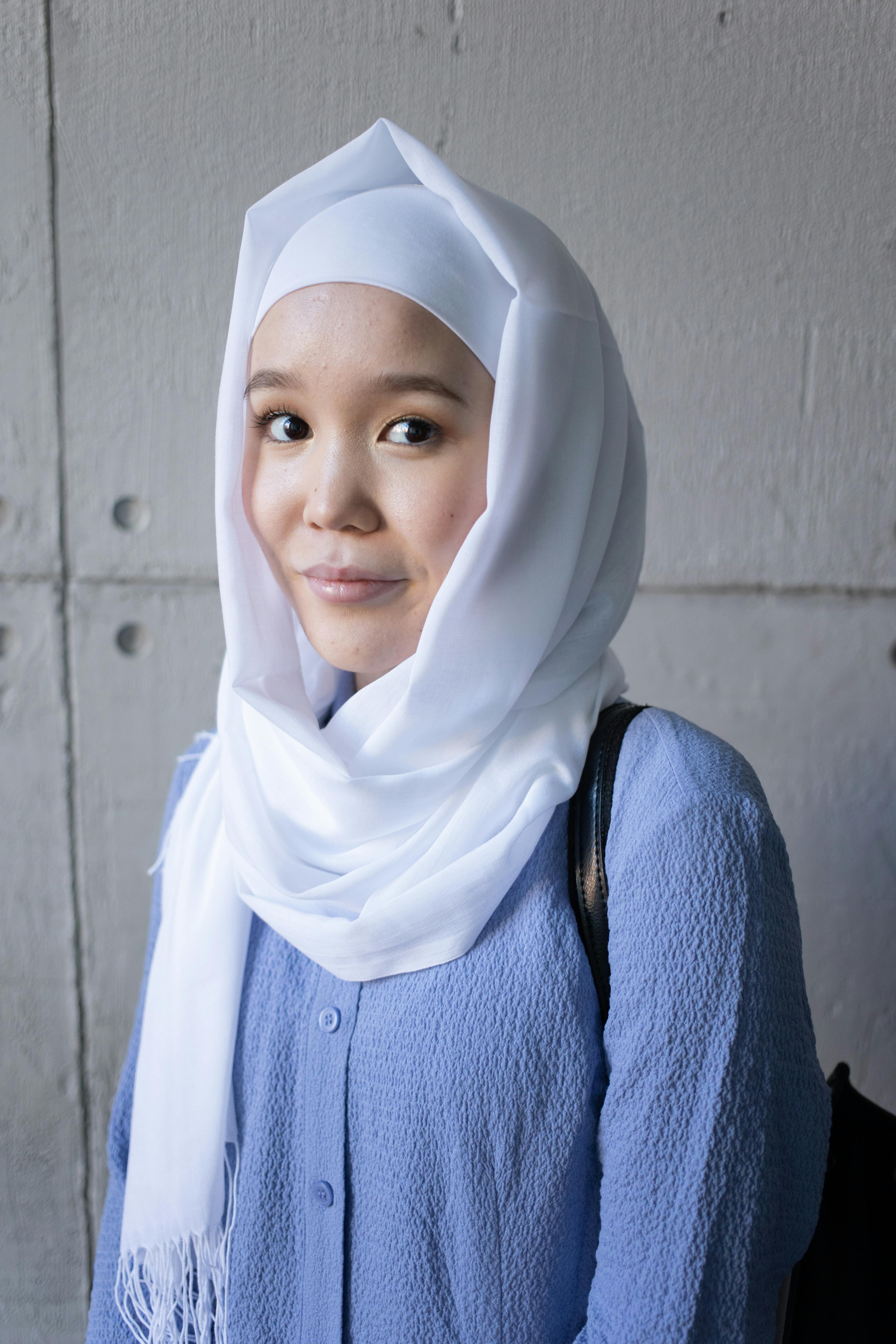 Muslim Young Woman Weared in Traditional Dress and Scarf Touches