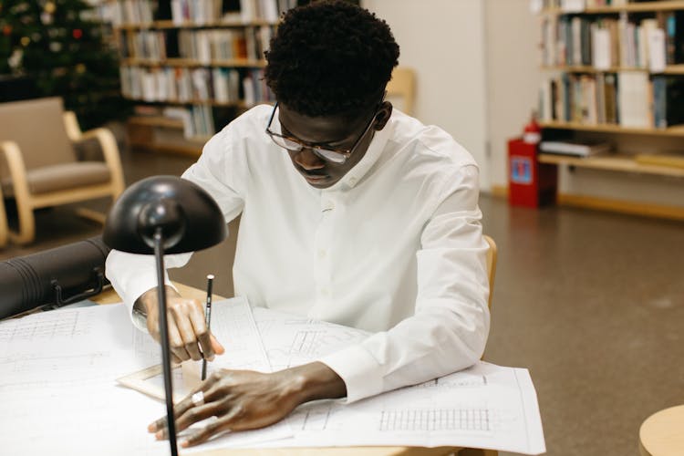 Man Working At A Library