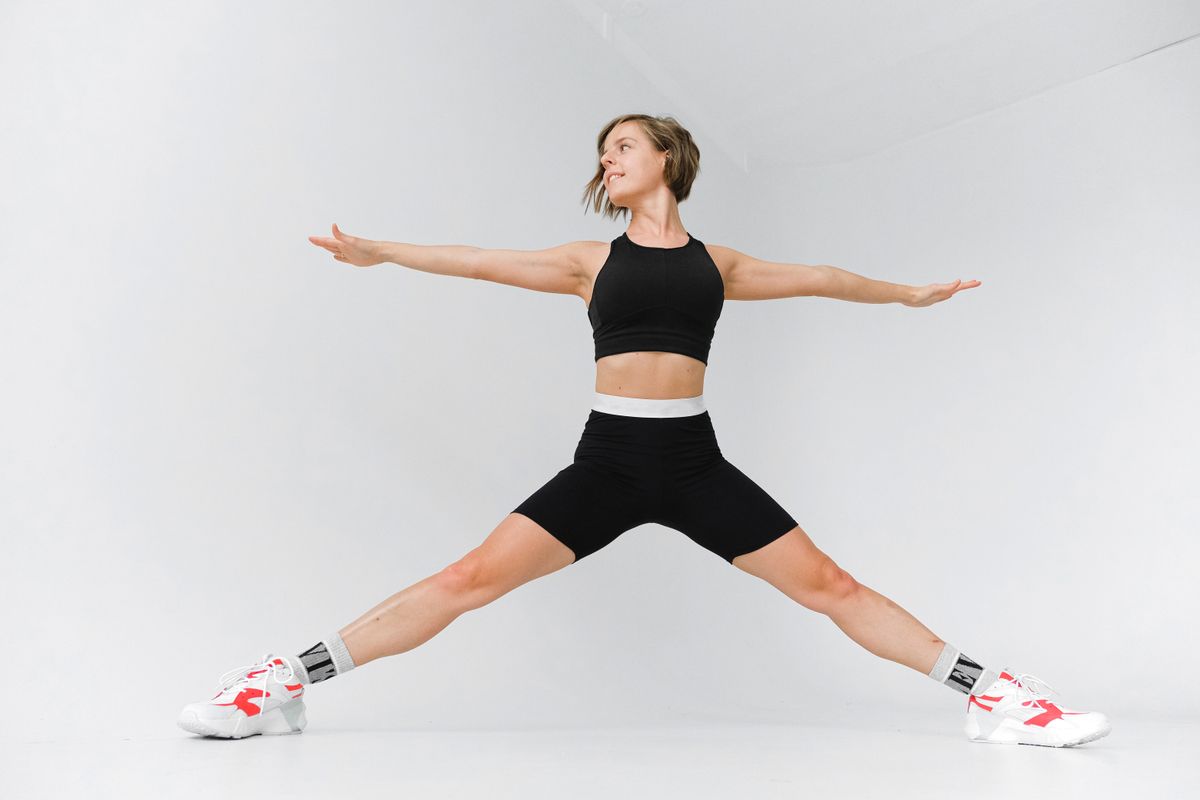 Woman stretching arms and legs during a break from work