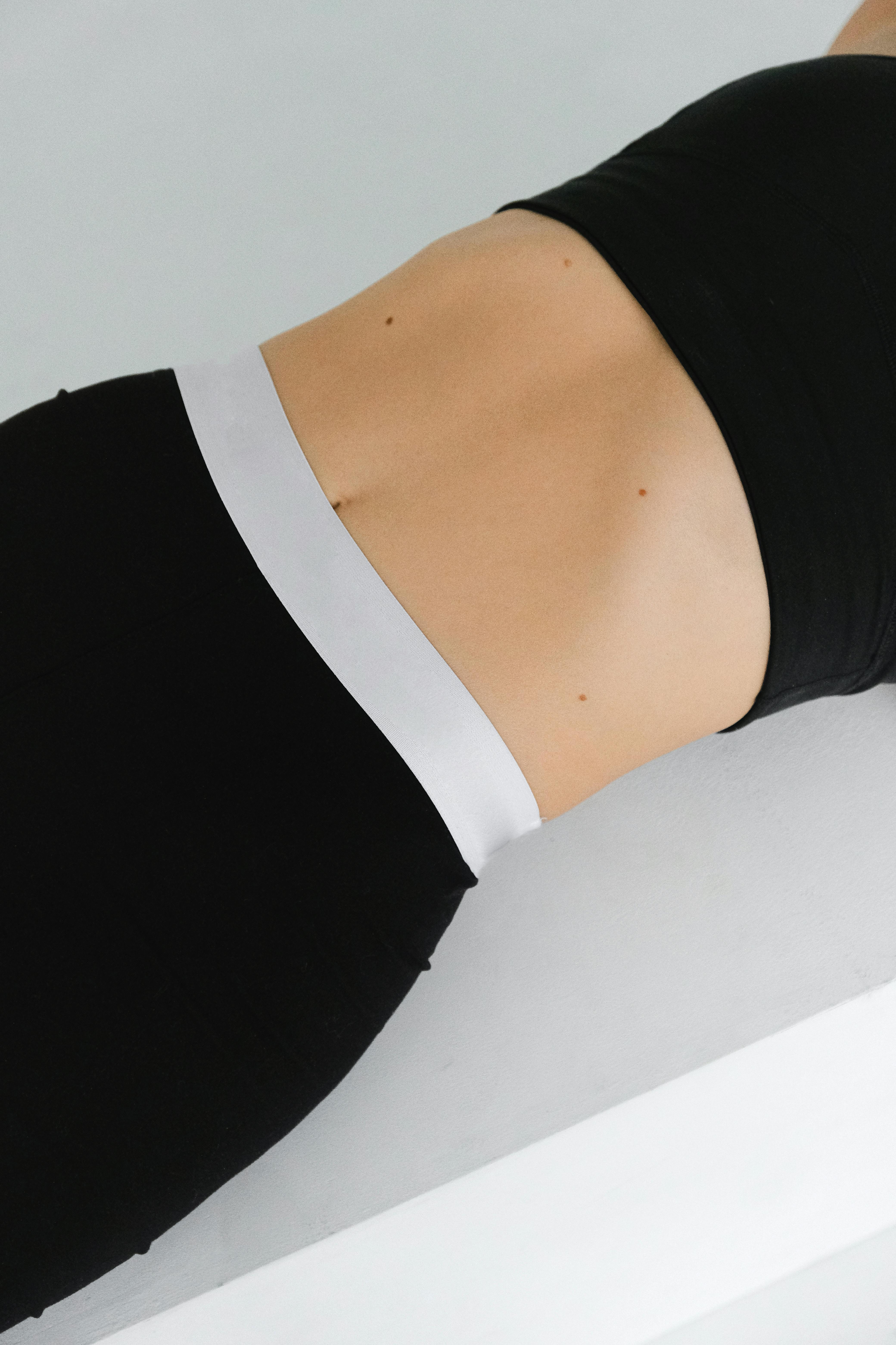 A minimalist capture showcasing fashion sportswear on a sleek white background.