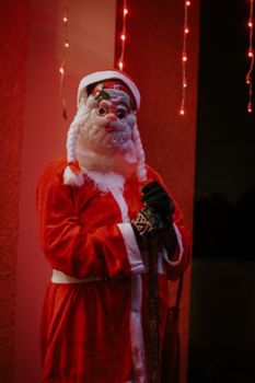 Santa Claus dressed in a classic red suit under festive lights, symbolizing the Christmas spirit.