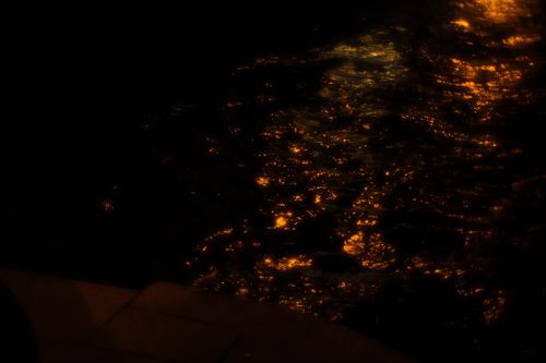 Free Glistening reflections on dark water at night create a moody and mysterious scene. Stock Photo