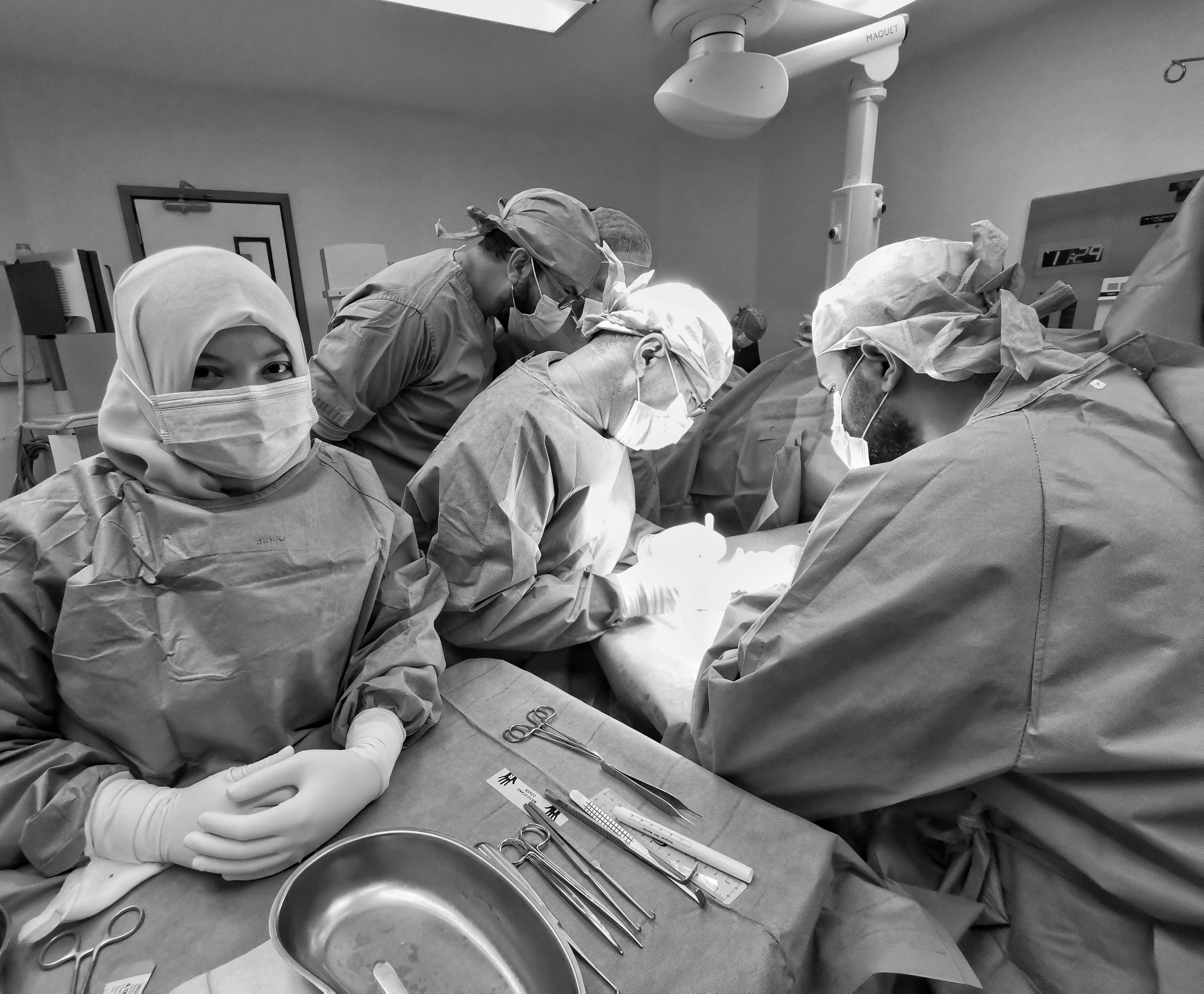 person in surgical gown looking at the camera