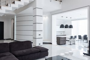 Modern furniture in spacious living room and kitchen