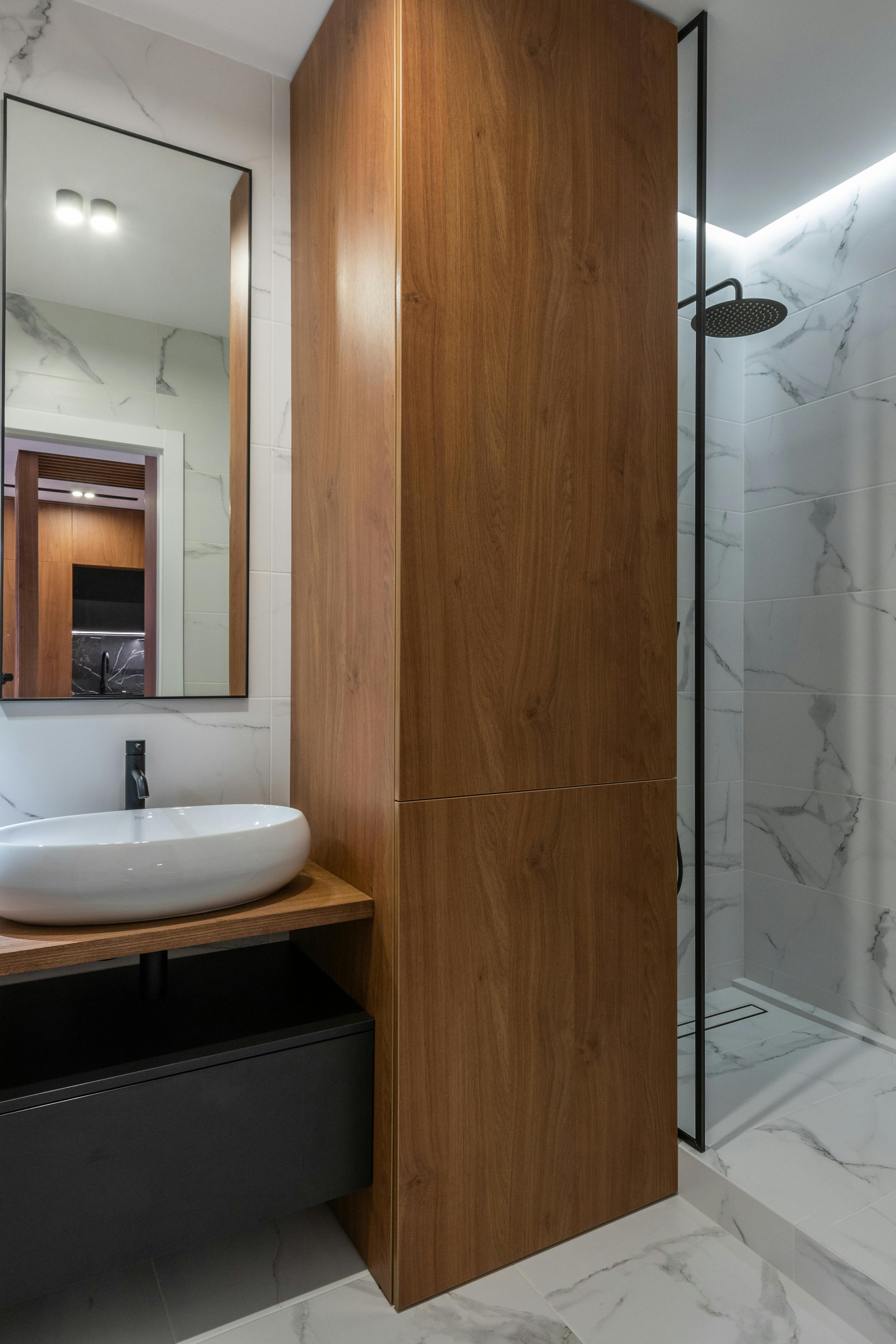 wooden details of modern bathroom with sink and shower cabin