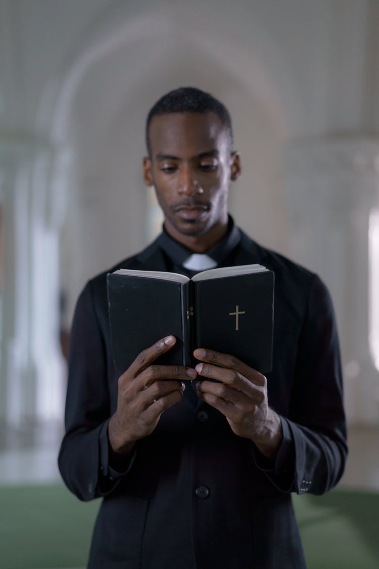 Man Reading A Bible